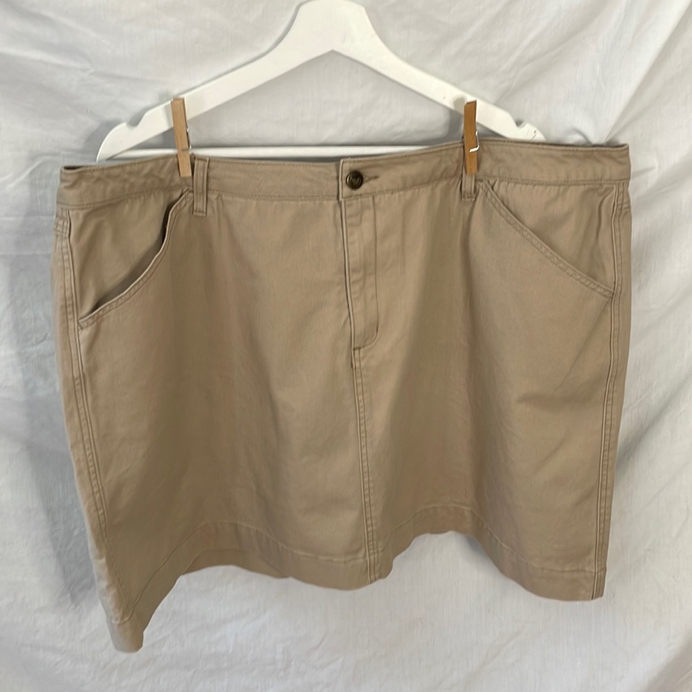 Woman within khaki denim skirt